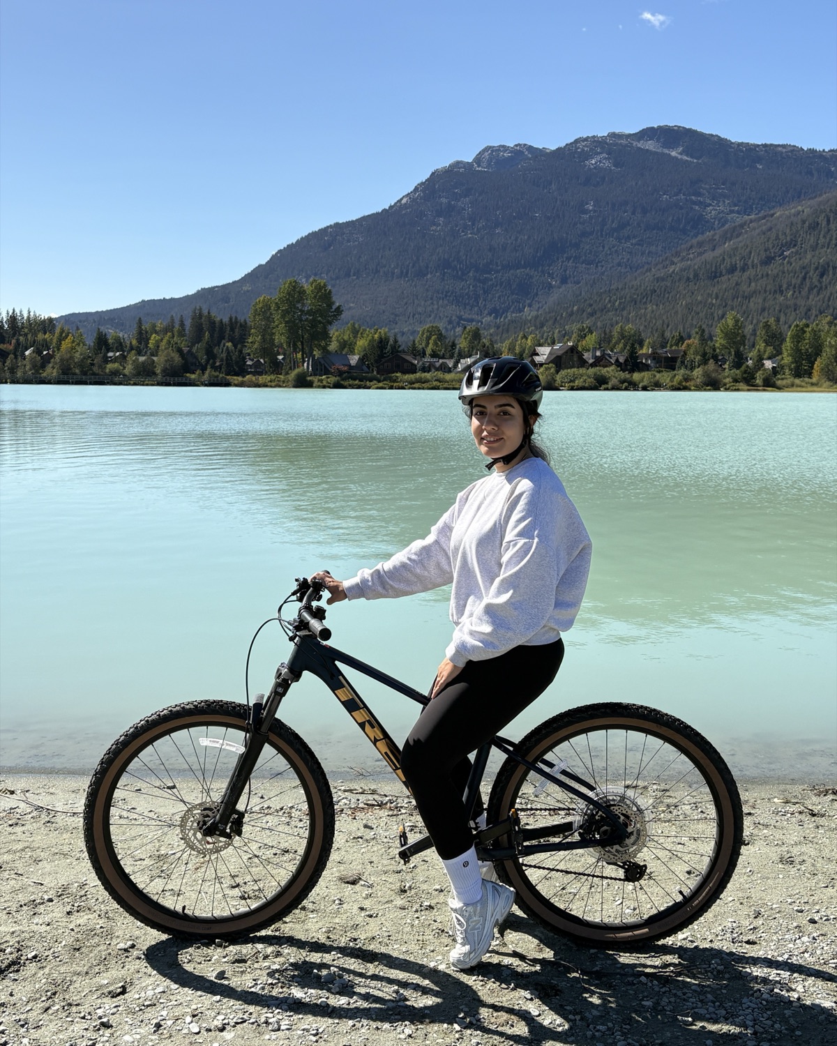 Mahtab Salimzadeh on a mountain bike beside a lake